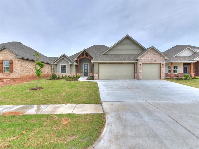 1715 Zayden Ln, Norman, OK 73072 - view of front of property with concrete driveway, a shingled roof, brick siding, a front lawn, and a garage
