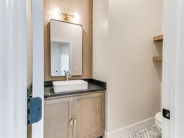 1715 Zayden Ln, Norman, OK 73072 - half bathroom with baseboards, tile patterned floors, toilet, and vanity