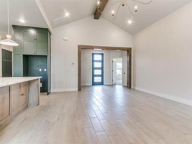 1715 Zayden Ln, Norman, OK 73072 - unfurnished living room with baseboards, high vaulted ceiling, beamed ceiling, and a notable chandelier