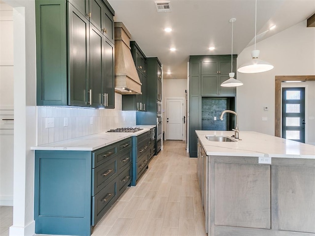1715 Zayden Ln, Norman, OK 73072 - kitchen with decorative backsplash, a sink, visible vents, stainless steel appliances, and custom exhaust hood