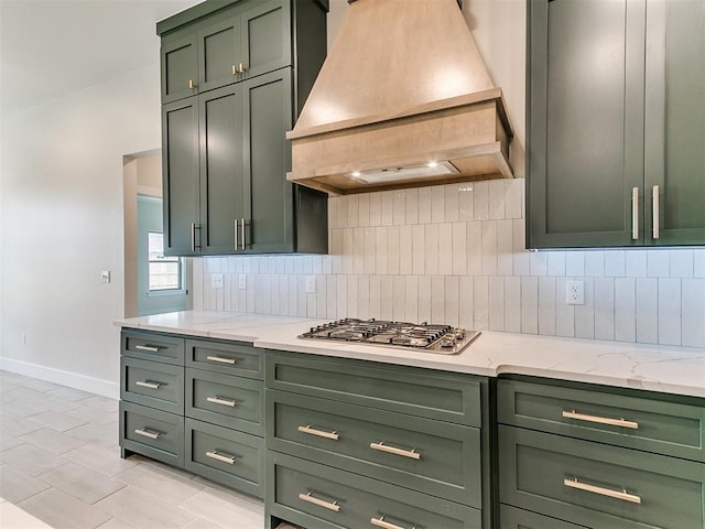 1715 Zayden Ln, Norman, OK 73072 - kitchen with custom range hood, green cabinets, and baseboards