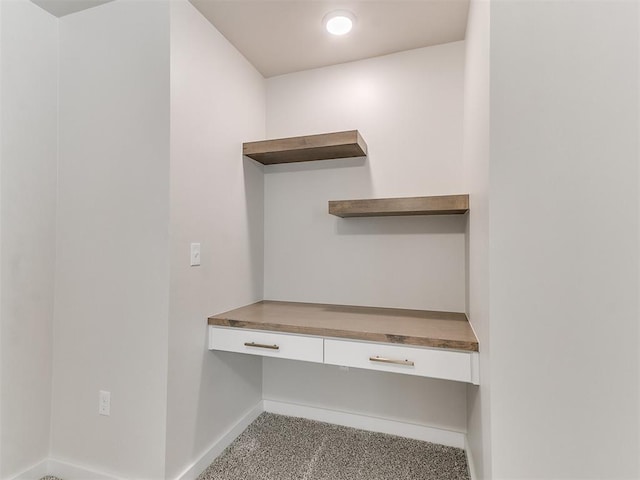 1715 Zayden Ln, Norman, OK 73072 - unfurnished office featuring carpet, built in desk, and baseboards