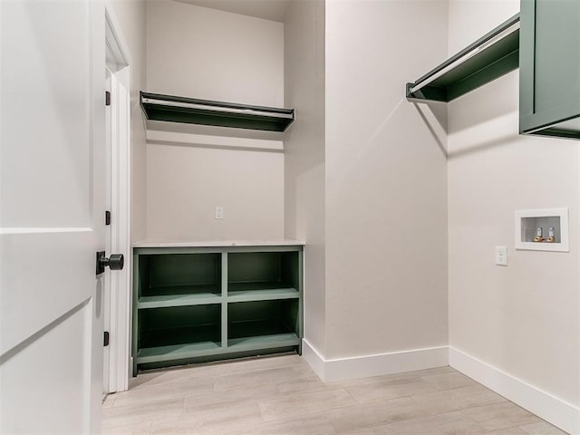1715 Zayden Ln, Norman, OK 73072 - laundry room with hookup for a washing machine, light wood-type flooring, cabinet space, and baseboards