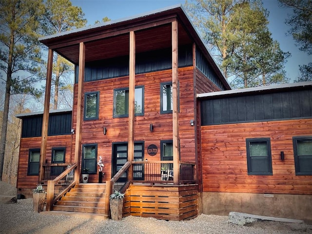 back of property featuring board and batten siding