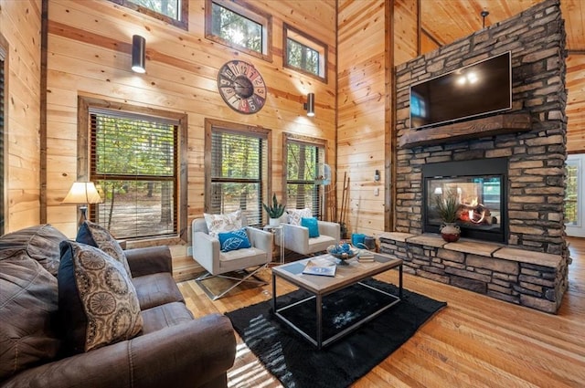88 Bent Pine Trl, Broken Bow, OK 74728 - living area featuring wood-type flooring, a wealth of natural light, and wood walls