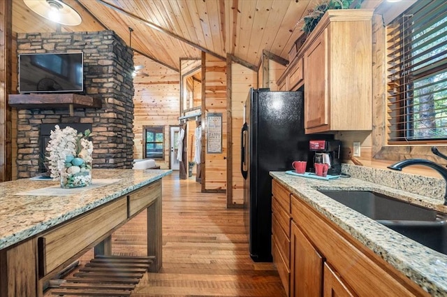 88 Bent Pine Trl, Broken Bow, OK 74728 - kitchen featuring a sink, light wood-style floors, wood ceiling, wood walls, and lofted ceiling