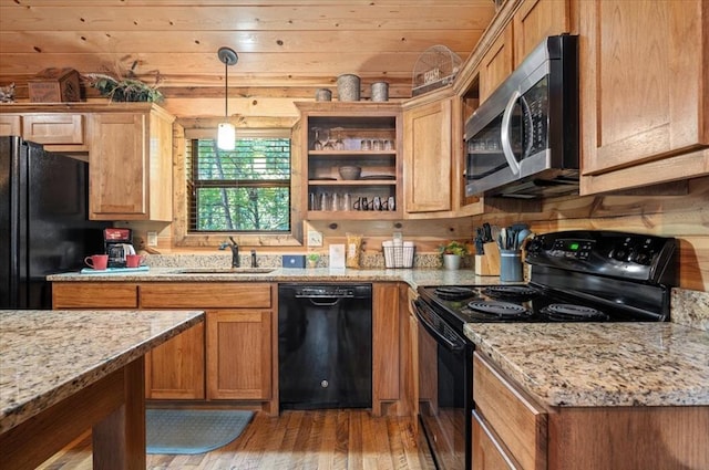 88 Bent Pine Trl, Broken Bow, OK 74728 - kitchen with light stone counters, a sink, light wood-style floors, and black appliances