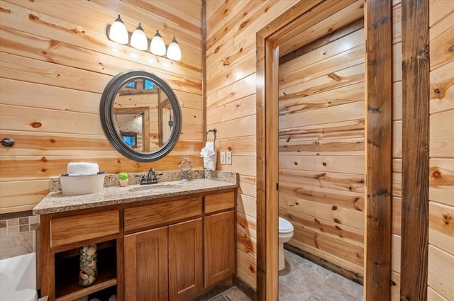 88 Bent Pine Trl, Broken Bow, OK 74728 - bathroom with wood walls, toilet, and vanity