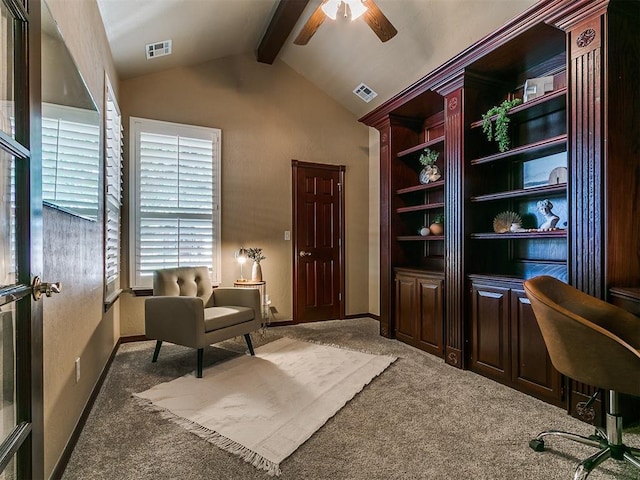 carpeted office space with ceiling fan, baseboards, lofted ceiling with beams, and visible vents