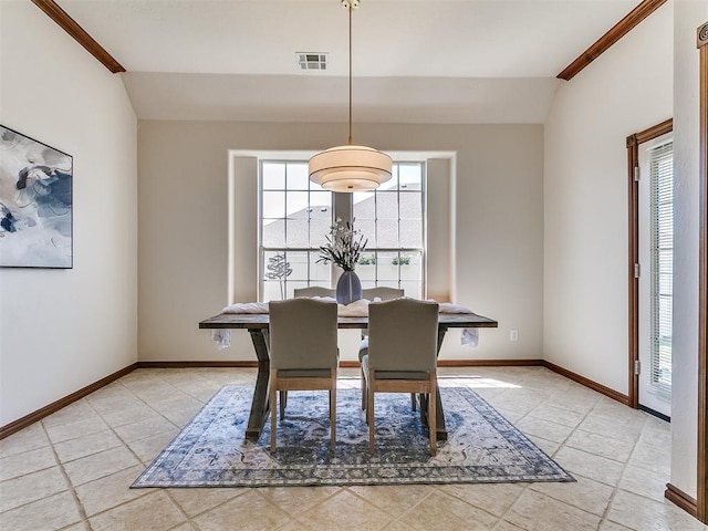 dining space with lofted ceiling, visible vents, baseboards, and light tile patterned floors