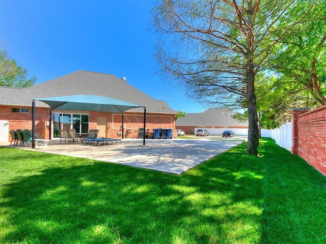 view of yard with fence and a patio area
