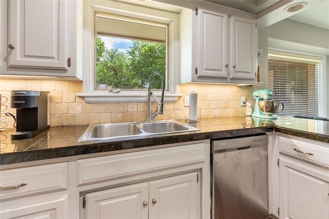 kitchen with a sink, backsplash, dishwasher, and white cabinets