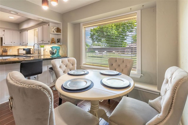 dining area featuring dark wood finished floors