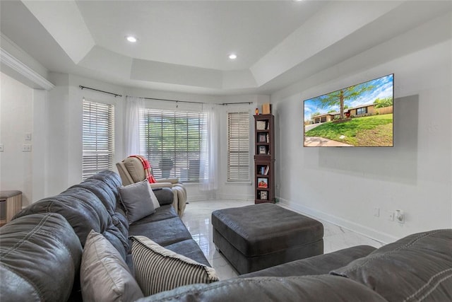 living area with baseboards, marble finish floor, a raised ceiling, and recessed lighting