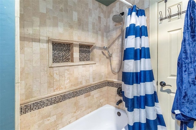 bathroom with shower / tub combo with curtain