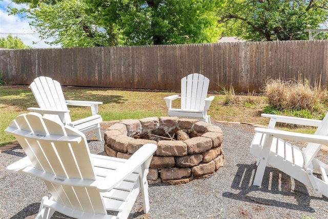 view of patio / terrace featuring fence and an outdoor fire pit