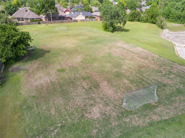 view of yard featuring fence and a residential view
