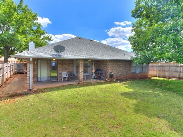 1717 Park View Pl, Edmond, OK 73003 - rear view of property featuring brick siding, a patio area, a shingled roof, and a chimney