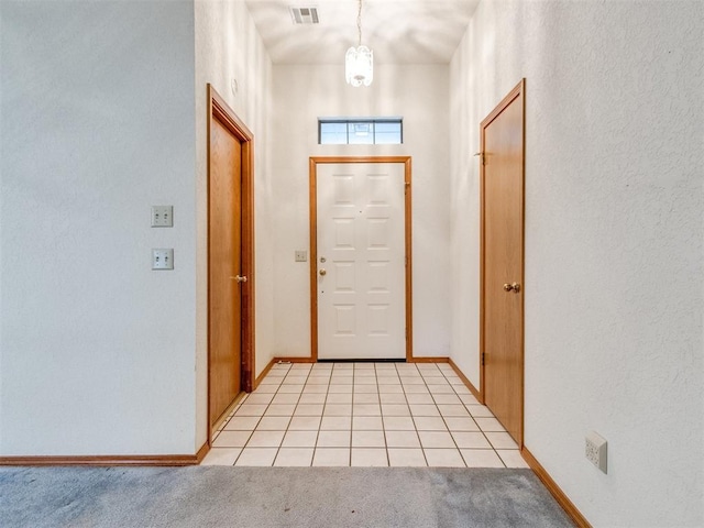 1717 Park View Pl, Edmond, OK 73003 - foyer entrance with baseboards, light carpet, and light tile patterned floors
