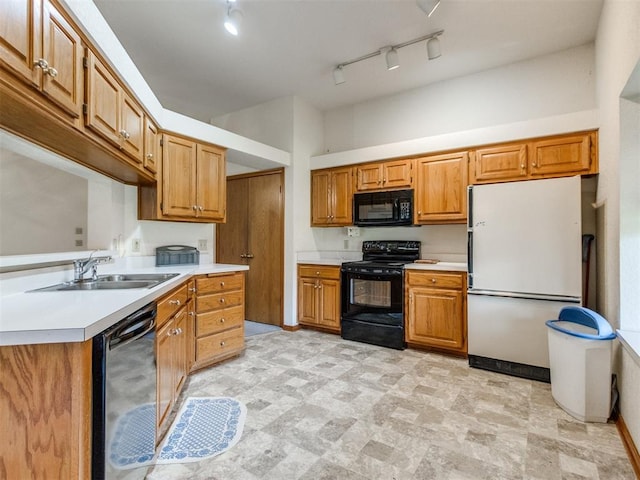 1717 Park View Pl, Edmond, OK 73003 - kitchen with black appliances, light countertops, a sink, and brown cabinetry
