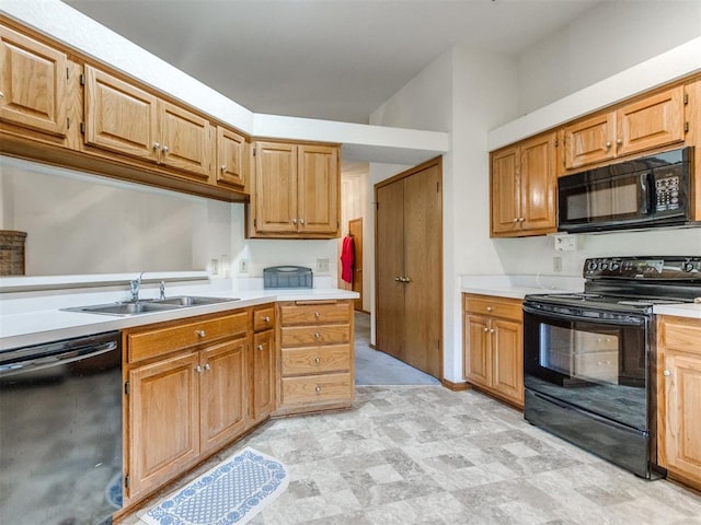 1717 Park View Pl, Edmond, OK 73003 - kitchen with black appliances, a sink, and light countertops