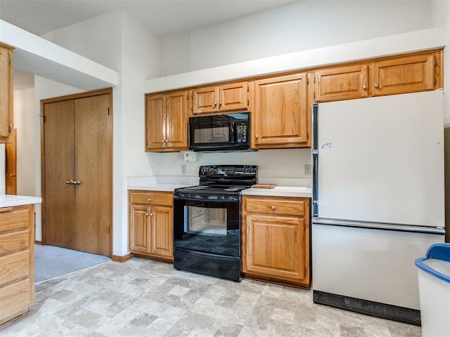 1717 Park View Pl, Edmond, OK 73003 - kitchen featuring black appliances, light countertops, and brown cabinets