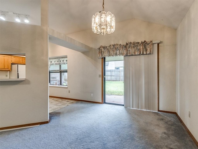 1717 Park View Pl, Edmond, OK 73003 - carpeted empty room with lofted ceiling, a chandelier, and baseboards