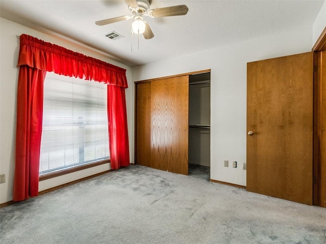1717 Park View Pl, Edmond, OK 73003 - unfurnished bedroom featuring carpet flooring, a closet, baseboards, and ceiling fan