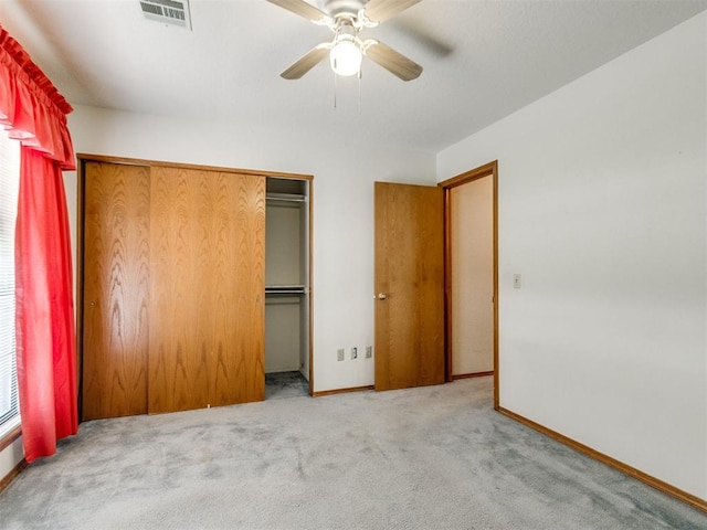 1717 Park View Pl, Edmond, OK 73003 - unfurnished bedroom featuring carpet floors, a closet, baseboards, and a ceiling fan