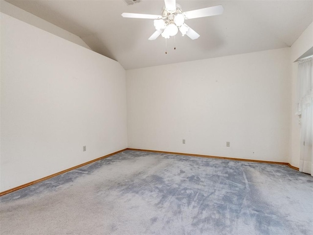 1717 Park View Pl, Edmond, OK 73003 - carpeted spare room featuring lofted ceiling, baseboards, and a ceiling fan