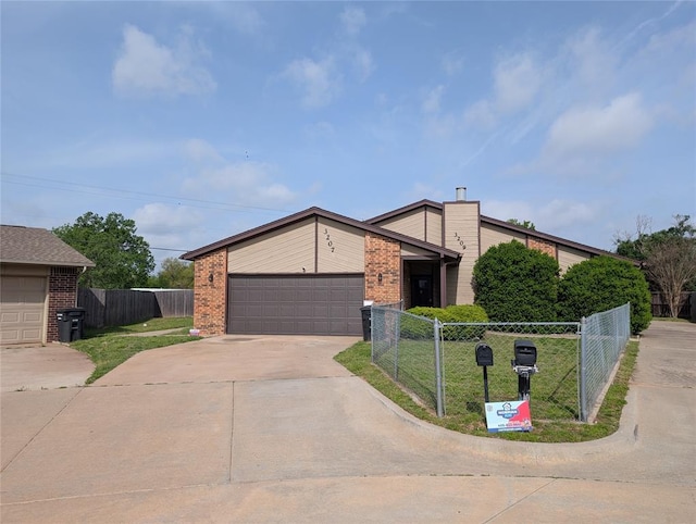 3207 Lois Arlene Cir, Moore, OK 73160 - mid-century inspired home with fence, brick siding, a garage, and concrete driveway