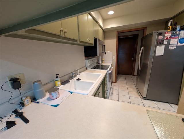 3207 Lois Arlene Cir, Moore, OK 73160 - kitchen with recessed lighting, light tile patterned flooring, stainless steel appliances, and a sink