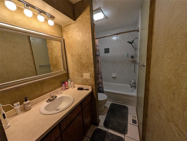 3207 Lois Arlene Cir, Moore, OK 73160 - full bathroom featuring tile patterned floors, shower / bath combo, a textured ceiling, toilet, and vanity