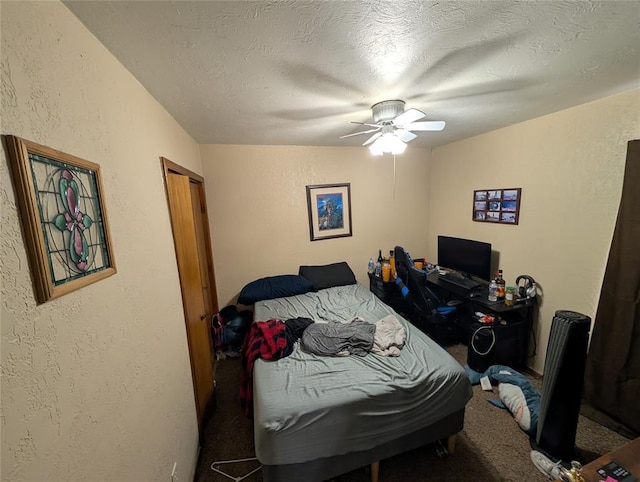 3207 Lois Arlene Cir, Moore, OK 73160 - carpeted bedroom with a textured wall, a ceiling fan, and a textured ceiling