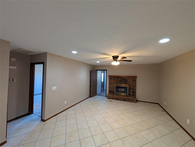 3207 Lois Arlene Cir, Moore, OK 73160 - unfurnished living room with baseboards, recessed lighting, a ceiling fan, a brick fireplace, and light tile patterned floors