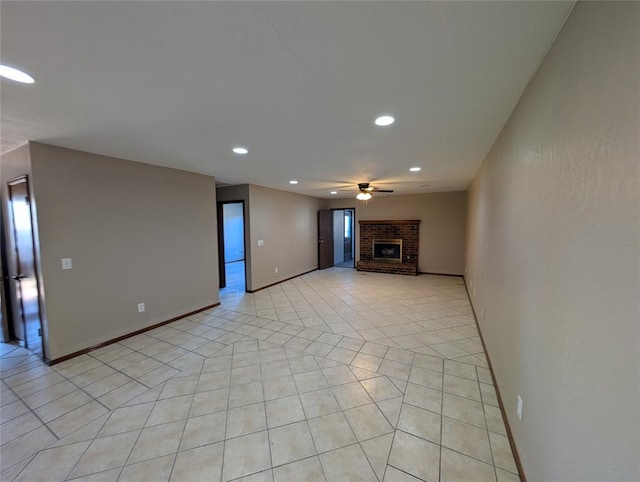 3207 Lois Arlene Cir, Moore, OK 73160 - unfurnished living room with recessed lighting, light tile patterned floors, baseboards, a brick fireplace, and ceiling fan