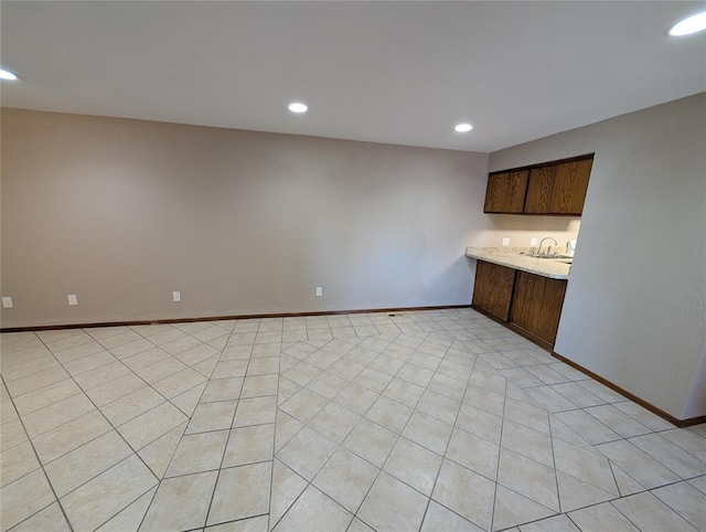 3207 Lois Arlene Cir, Moore, OK 73160 - interior space featuring baseboards, a sink, and recessed lighting