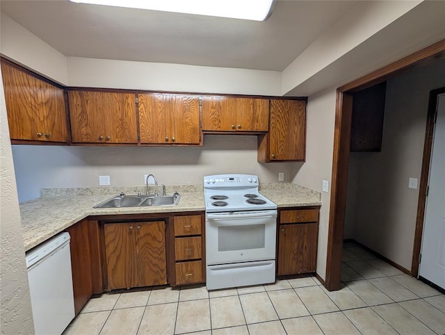 3207 Lois Arlene Cir, Moore, OK 73160 - kitchen featuring light countertops, brown cabinets, a sink, and white appliances