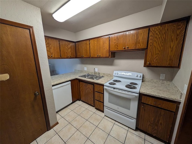 3207 Lois Arlene Cir, Moore, OK 73160 - kitchen with light countertops, a sink, light tile patterned flooring, white appliances, and brown cabinetry