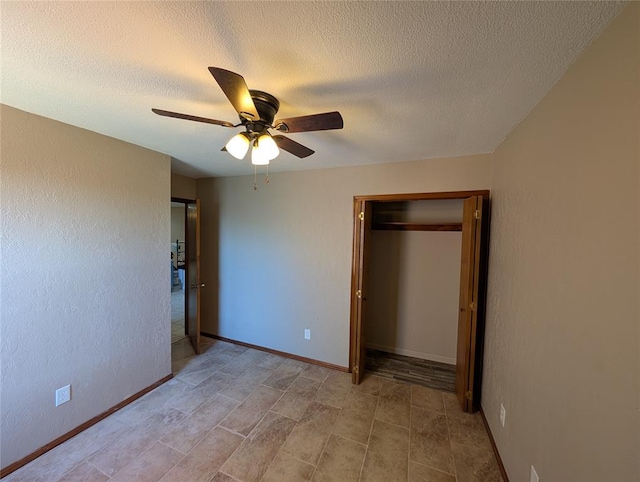 3207 Lois Arlene Cir, Moore, OK 73160 - unfurnished bedroom featuring baseboards, a textured ceiling, a closet, and ceiling fan