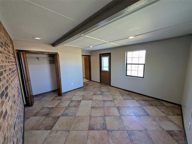 3207 Lois Arlene Cir, Moore, OK 73160 - unfurnished bedroom featuring baseboards and stone finish floor
