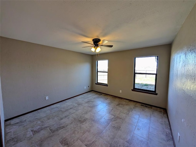 3207 Lois Arlene Cir, Moore, OK 73160 - unfurnished room with ceiling fan, baseboards, a textured ceiling, and visible vents