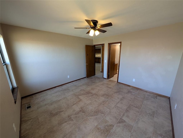 3207 Lois Arlene Cir, Moore, OK 73160 - unfurnished bedroom with ceiling fan, baseboards, and visible vents