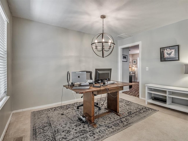office space with plenty of natural light, visible vents, light carpet, and an inviting chandelier
