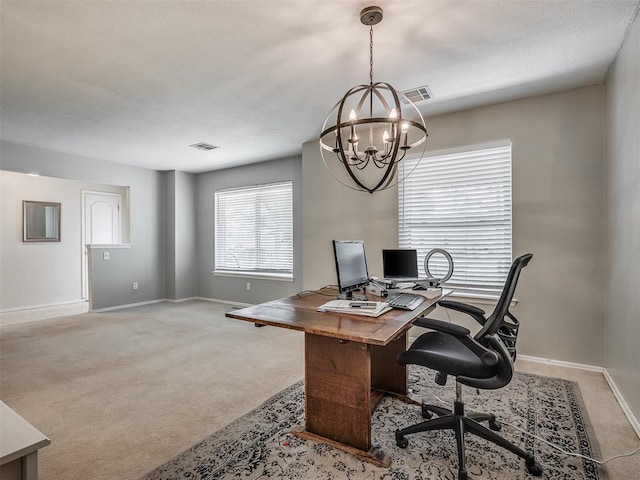 office space featuring visible vents, baseboards, and an inviting chandelier