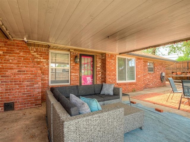 view of patio featuring an outdoor living space, visible vents, and fence