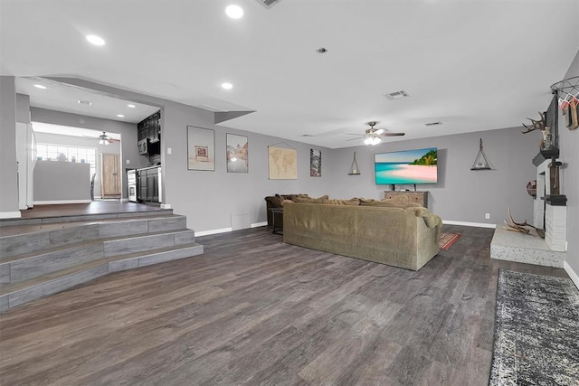 113 Central Dr, Sayre, OK 73662 - living room with baseboards, a ceiling fan, and dark wood-style flooring