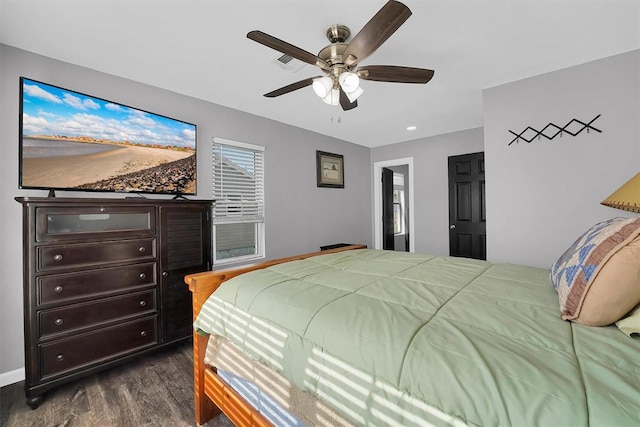 113 Central Dr, Sayre, OK 73662 - bedroom featuring a ceiling fan and dark wood-type flooring