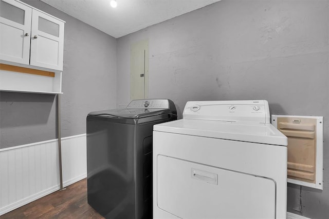 113 Central Dr, Sayre, OK 73662 - laundry area featuring cabinet space, dark wood-type flooring, and separate washer and dryer