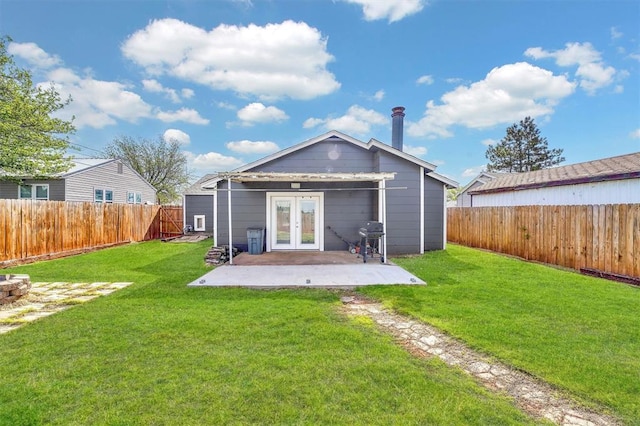 113 Central Dr, Sayre, OK 73662 - rear view of property with a fenced backyard, a yard, a patio, and french doors